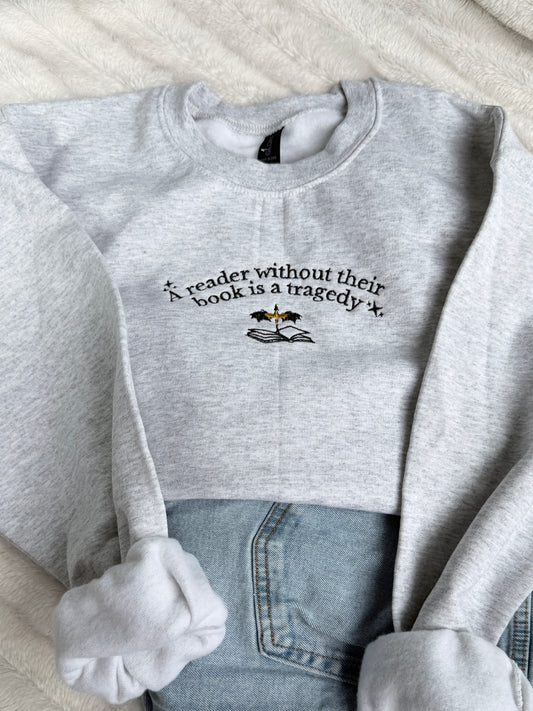A Reader Without Their Book Is A Tragedy Crewneck